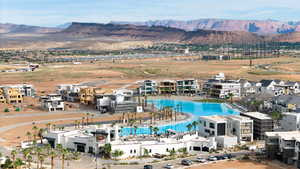 Aerial view of a mountain backdrop and a pool area
