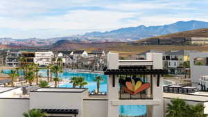 Community pool featuring a mountain view, a pergola, a residential view, and a patio area