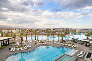 Community pool featuring a mountain view and a patio