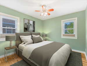 Bedroom featuring wood finished floors and ceiling fan