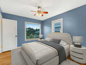 Bedroom featuring light wood-style flooring and ceiling fan