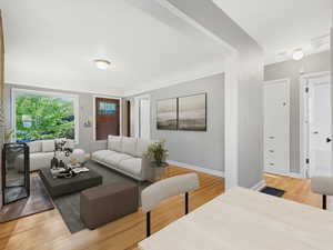 Living room featuring light wood finished floors and baseboards