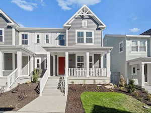 View of front of property with a porch and board and batten siding