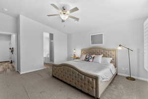 Primary Bedroom featuring carpet, a ceiling fan, and connected bathroom