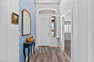 Foyer with wallpaper accent wall