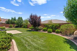 Fenced backyard with a patio area