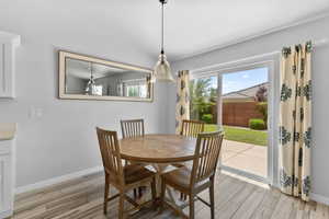 Dining space featuring light wood-look tile flooring