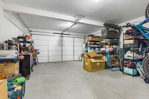 Garage featuring a garage door opener