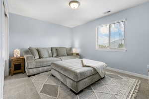 Living room featuring carpet and baseboards