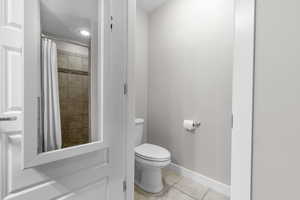 Full bathroom featuring tile patterned floors and tiled shower