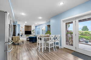 Dining space featuring wood finished floors and recessed lighting