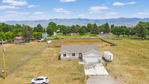 Aerial view of sparsely populated area featuring a mountain backdrop