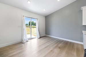Spare room featuring light wood-style floors and recessed lighting