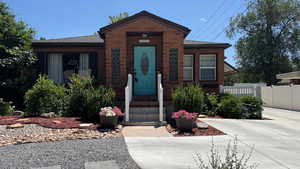 View of front of home featuring roof with shingles