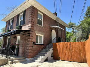 View of front of property featuring brick siding