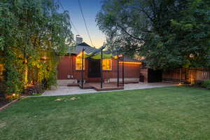 Rear view of property featuring a patio area and a deck