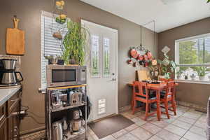 Kitchen with side entry and dining area