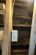 Basement light switch next to basement stairs
