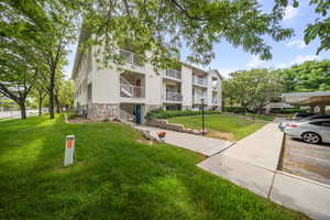 View of property featuring a parking lot