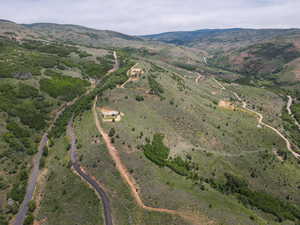 Aerial view of property and surrounding area with mountains