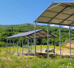 View of community featuring a forest view and a gazebo