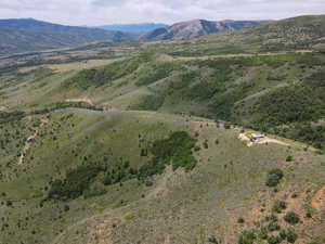 Aerial view of property's location with mountains