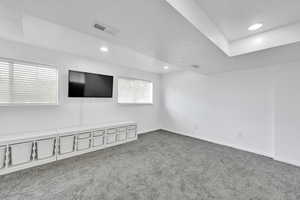 Carpeted spare room with recessed lighting and a textured ceiling