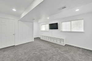 Basement with carpet flooring and recessed lighting