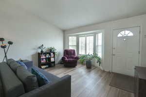 Living room with light wood-style flooring