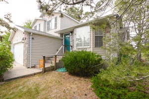 Tri-level home with a garage and driveway