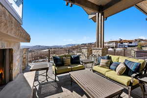 View of patio / terrace with an outdoor living space and a mountain view