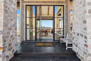 Property entrance featuring stone siding