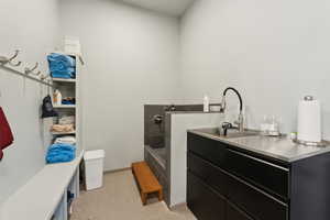 Bathroom with baseboards and a sink