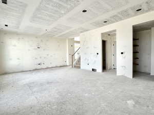 Unfurnished room with stairway
