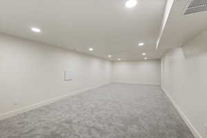 Finished basement featuring recessed lighting and carpet flooring