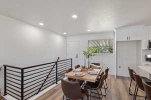 Dining area featuring recessed lighting and light wood-style flooring