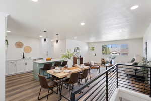 Dining area with recessed lighting and wood finished floors