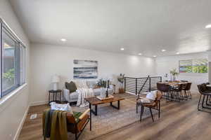 Living room featuring wood finished floors and recessed lighting