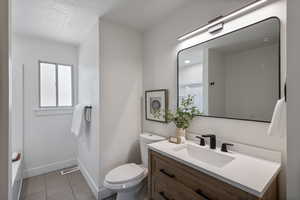 Bathroom featuring vanity and tile patterned flooring