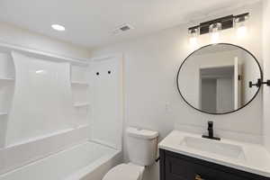 Full bath with vanity, bathing tub / shower combination, and recessed lighting
