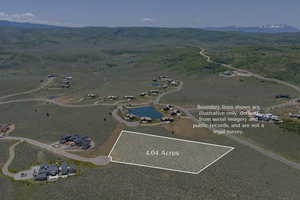 Aerial overview of property's location featuring a mountainous background and property parcel outlined