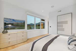 Bedroom featuring light wood-type flooring and recessed lighting