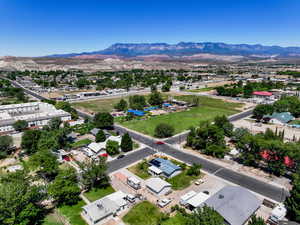 Aerial perspective of suburban area featuring a mountain backdrop