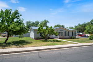 View of front of house featuring a front lawn