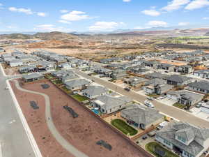 Aerial perspective of suburban area featuring a mountain backdrop