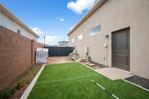 Fenced backyard featuring a patio