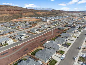Aerial view of residential area featuring a mountainous background