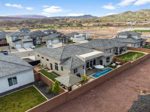 Aerial perspective of suburban area with a mountainous background