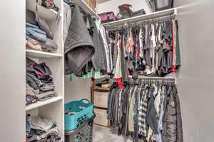 Walk in closet in primary bathroom