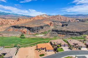 View of property location featuring a mountain backdrop and nearby suburban area